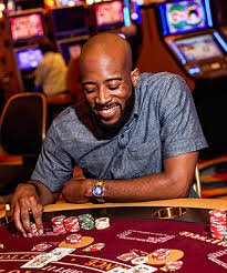 Live dealer conducting Dragon Tiger game with real cards for authentic casino entertainment